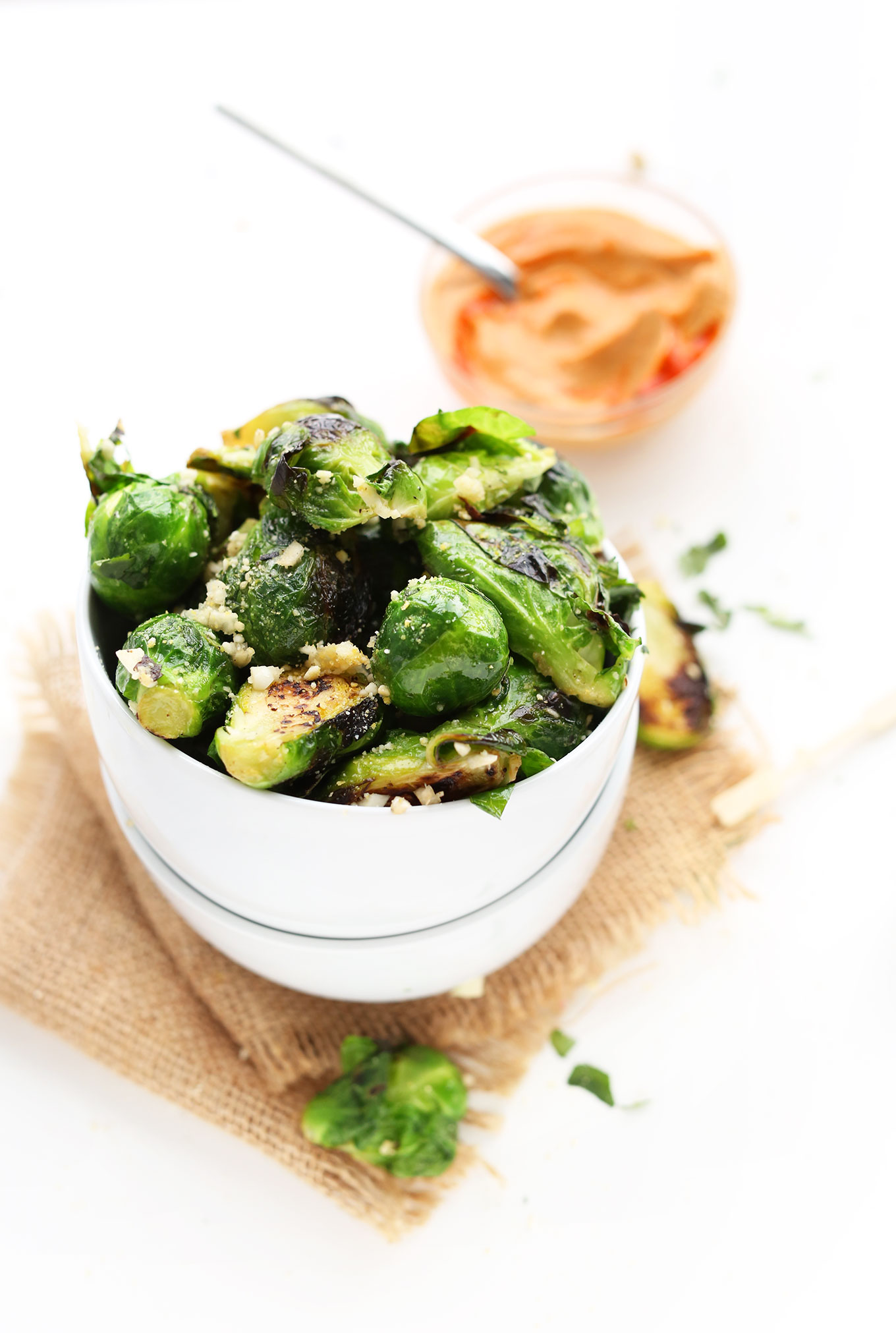 Bowl of Crispy Roasted Brussels Sprouts to be dipped in our spicy Sriracha Aioli recipe
