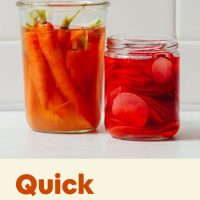 pickled carrots in a mason jar with recipe title